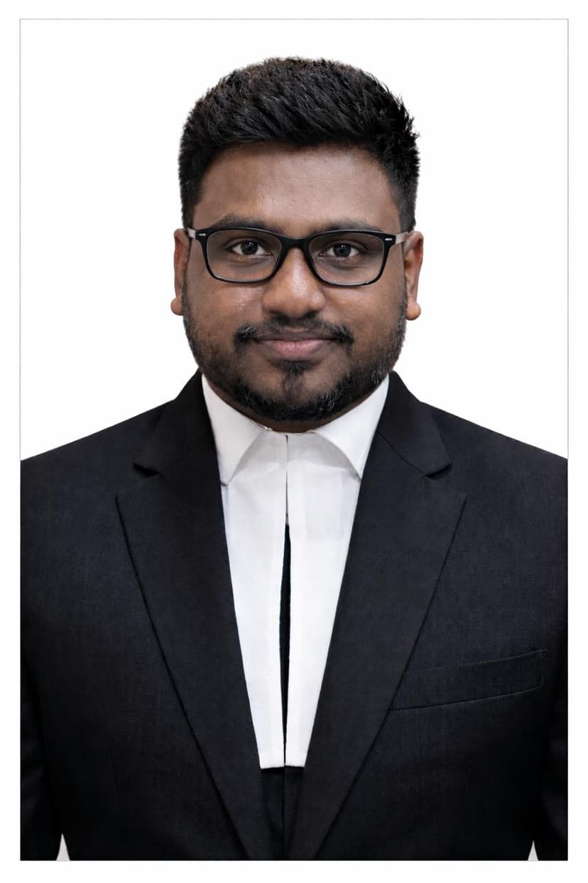 A professional portrait of Adv. J. Joseph Bosco.